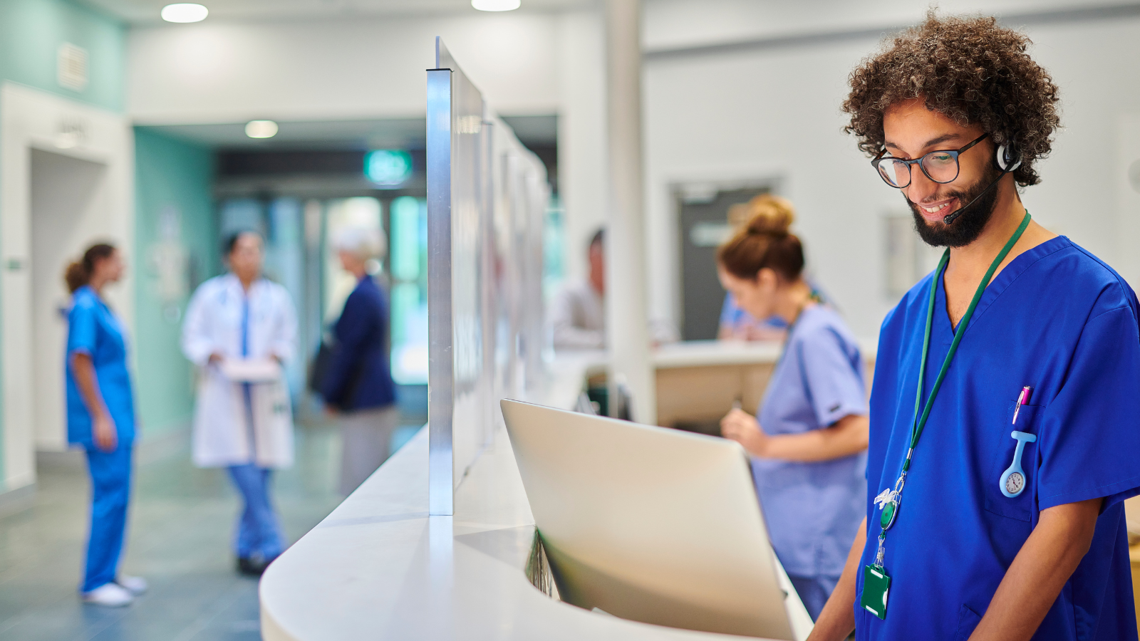 Male Nurse at nurses station. CME Medical Spanish 101 Online Course